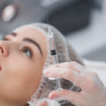 Syringe with filler for face contouring or augmentation. Model, point of view. Cosmetological clinic. Healthcare, cosmetology, clinic